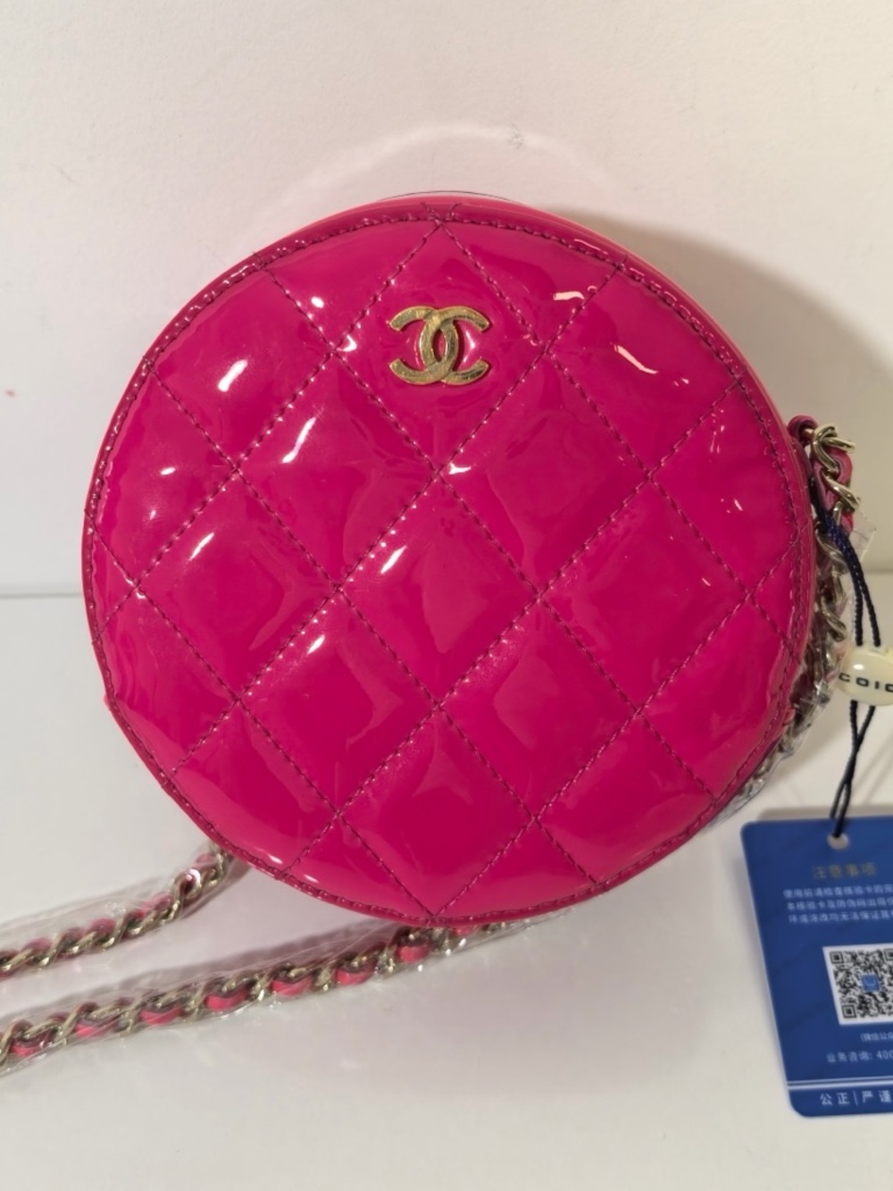 CHANEL Hot Pink Quilted Patent Leather Round Crossbody with Gold CC
